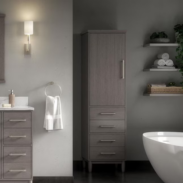 Bathroom with wooden cabinet, sink, and bathtub.