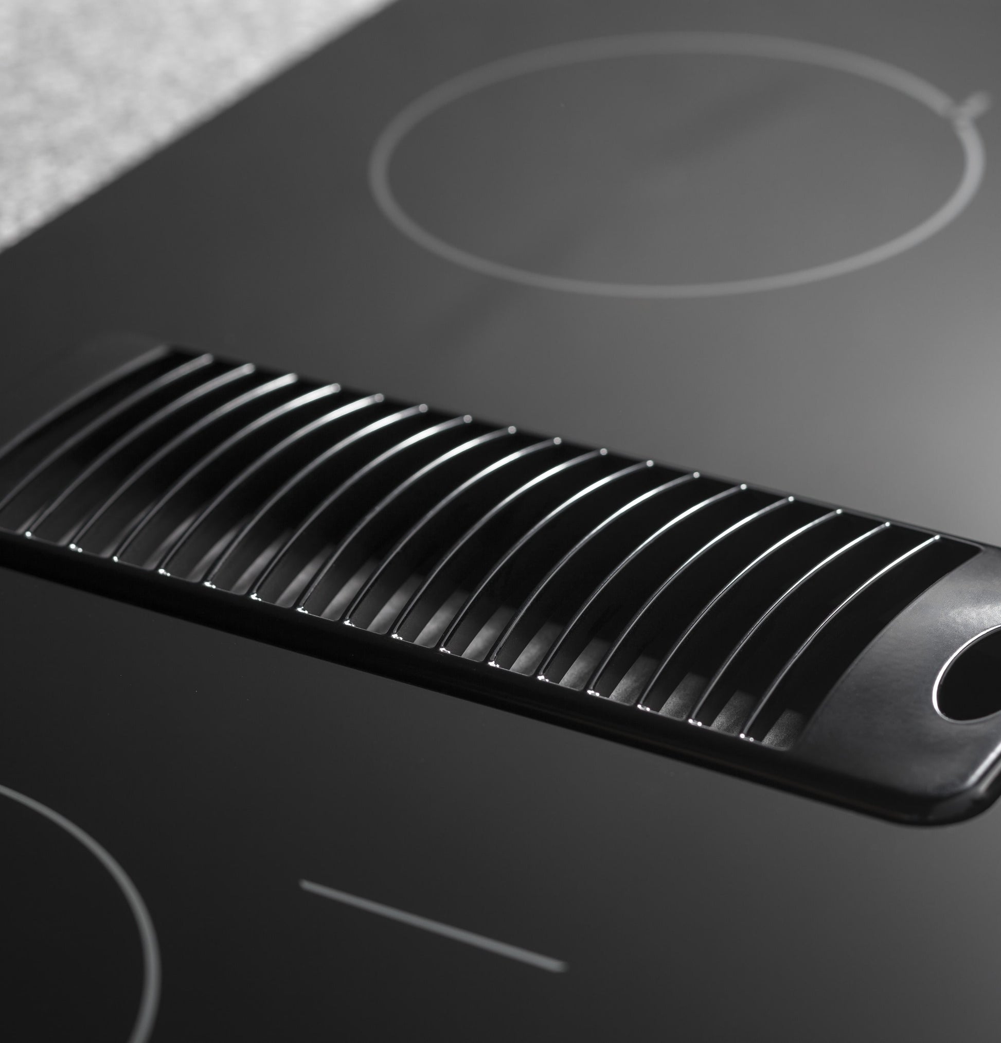 GE Profile 30-in 4 burners Smooth surface Black Electric Cooktop with Downdraft Exhaust with Bridge Element