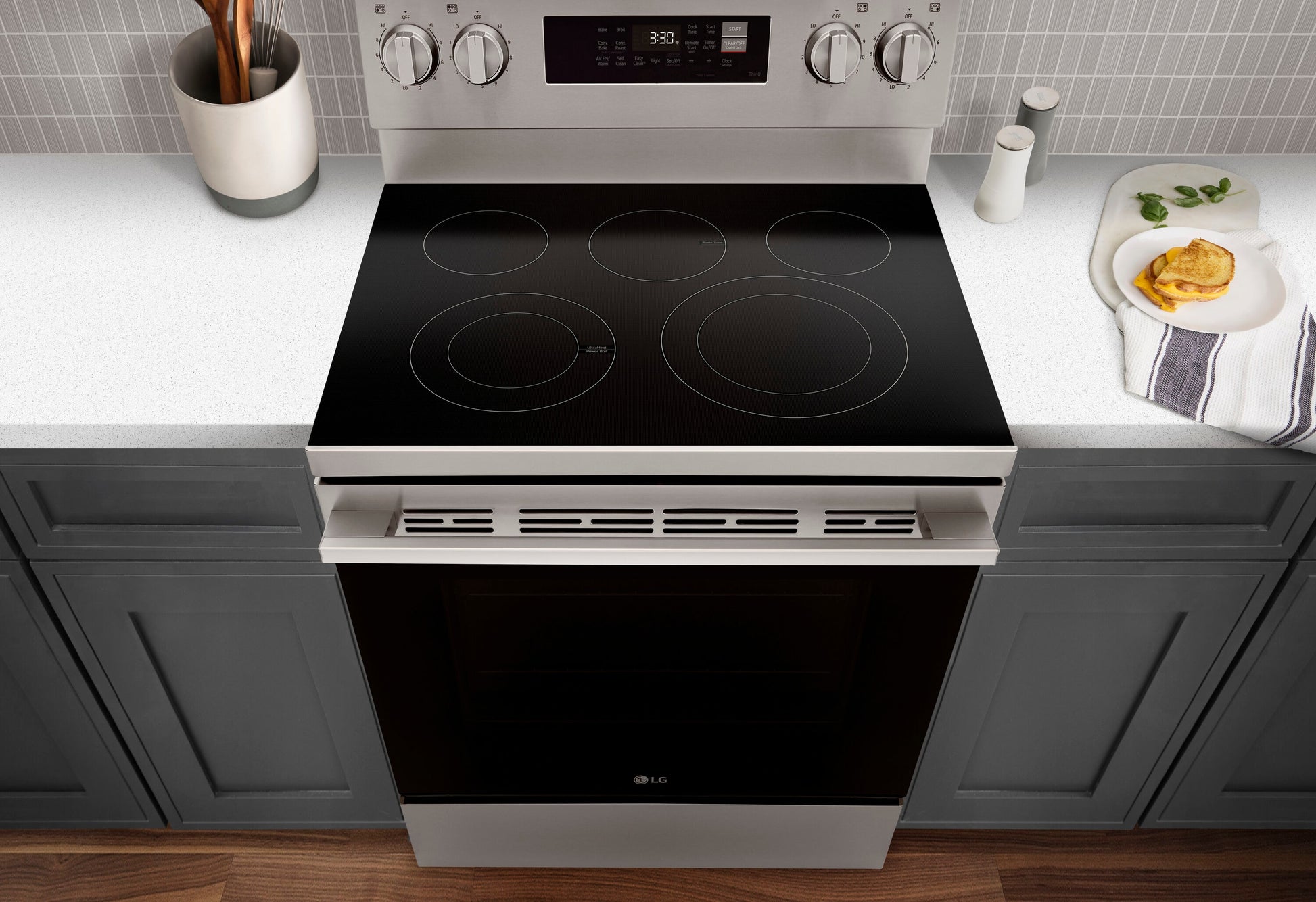 LG 30-in Glass Top 5 burners 6.3-cu ft Air Fry Convection Oven Freestanding Electric Range with WipeClean Coating ( Stainless Steel )