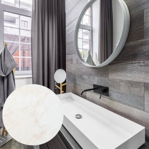 Modern bathroom with a sink, mirror, and decorative light fixture.