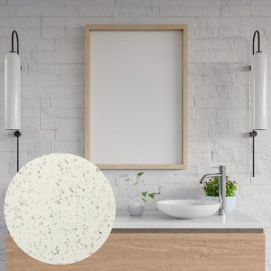 Bathroom with a framed mirror and sink, featuring a close-up of a white stone texture.