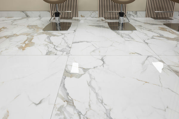 Close-up of a marble-like floor with a patterned design.
