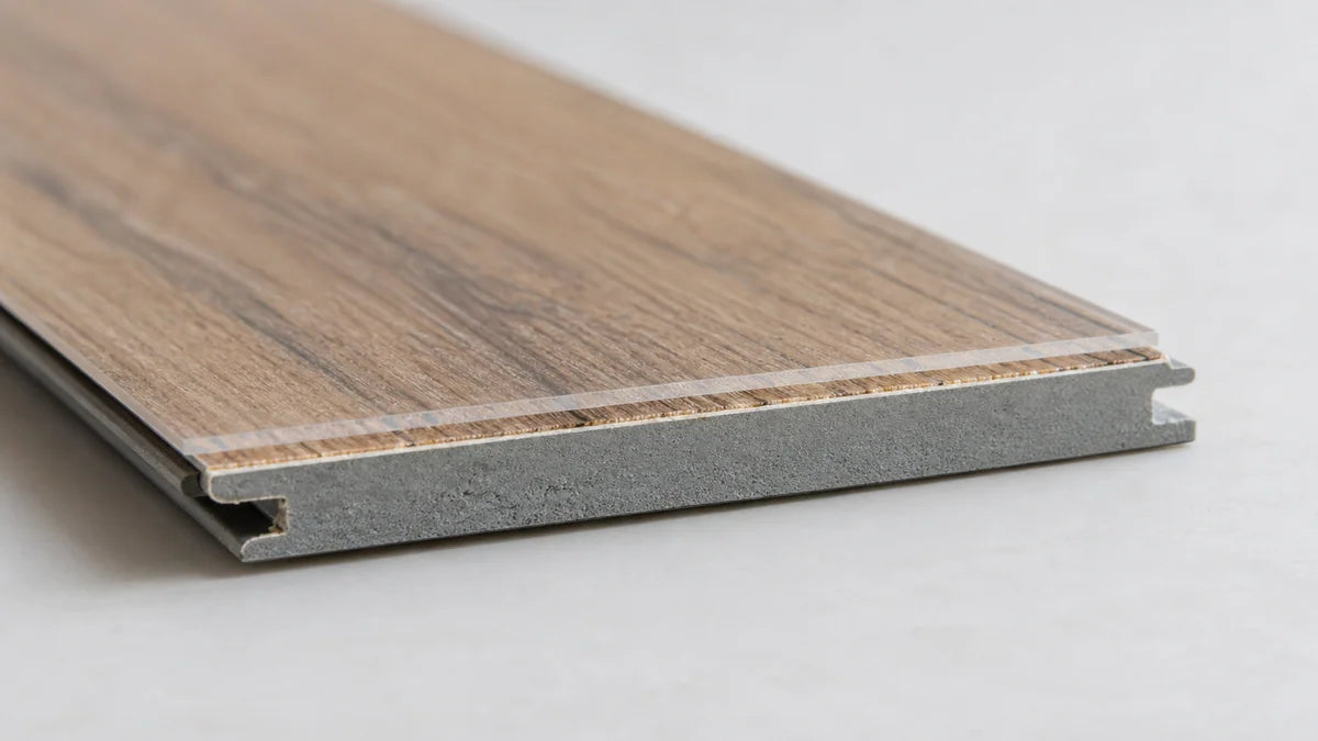 Close view of the thin surface and core of a wood-look vinyl plank